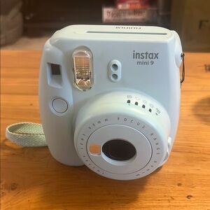 Fujifilm Blue Instax mini 9 film camera with case